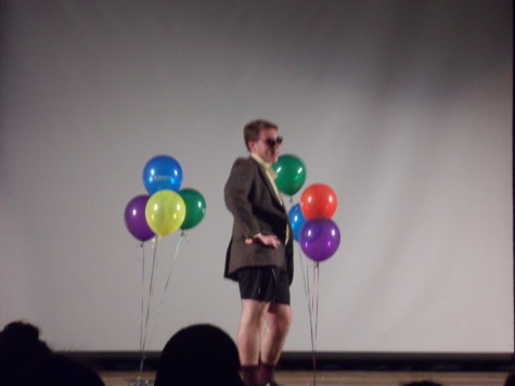Senior Simon Hershey struts his stuff in the fashion show, showing his "swag". 