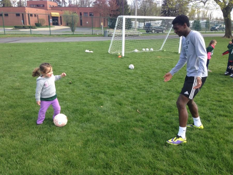 Jacob Cheeseborough and Addison Lane kick a soccer ball back and forth. 