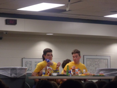 Senior Luke Baterman and Griffin Mann play Dinner and a Show at Wingin' It, where they could not use their hands, and eat "disgusting" variations of food in front of them.  