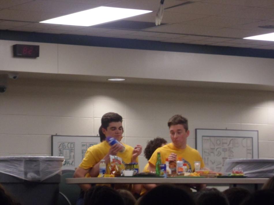 Seniors Griffin Mann and Luke Bateman play Dinner and a Show at Wingin It!, where they could not use their hands, and had to eat disgusting variations of food in front of them.  