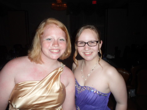 Juniors Tiffany Smith and Lea Cobaugh posing for the camera and having fun at 2014 Prom. 