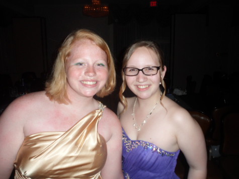 Juniors Tiffany Smith and Lea Cobaugh posing for the camera and having fun at 2014 Prom.