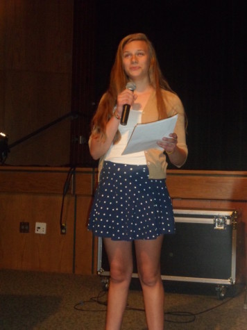 Sophomore Mary Smith reads her poem to the audience.