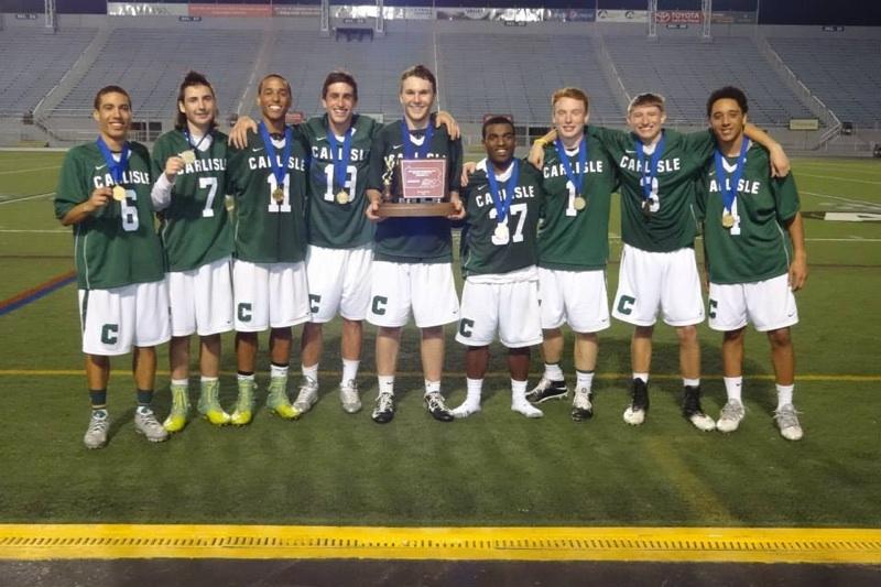 The+senior+boys+pose+for+a+picture+with+the+District+Title+trophy.+These+seniors+have+been+playing+together+all+4+years+of+their+high+school+careers.