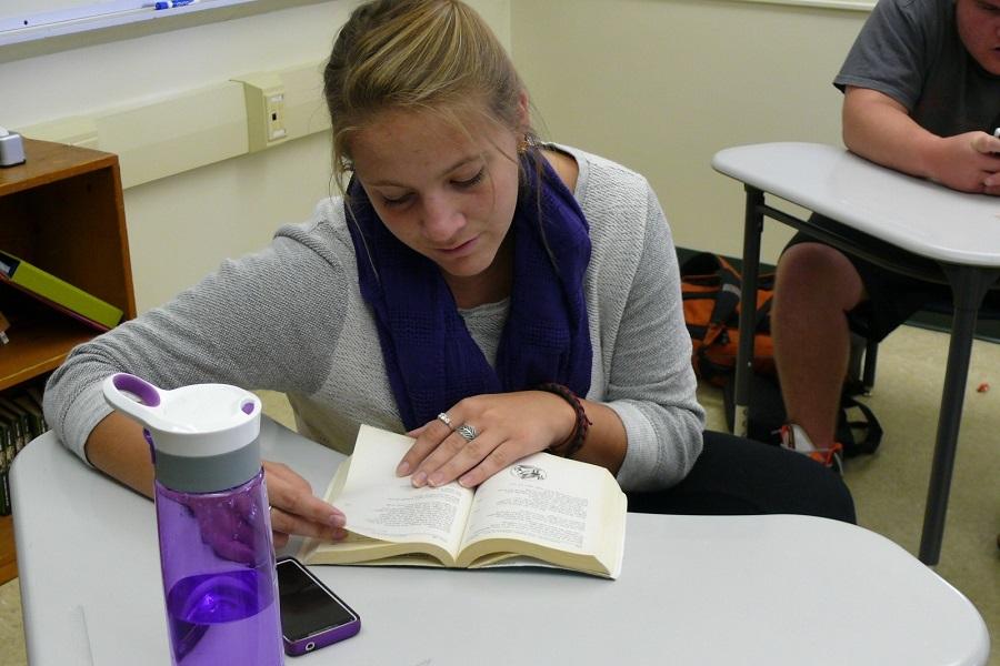Senior Jamie Frohm gets engrossed in the play, Oedipus Rex, during English class. Reading offers the opportunity to be transported to a different time and place.  
