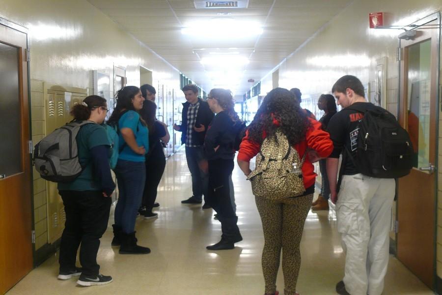 Students crowd the halls, making it challenging for others to get to class.