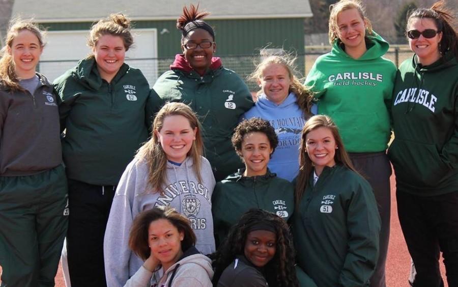 Coach Xaviera Eastham, a new coach on the track and field team, with athletes