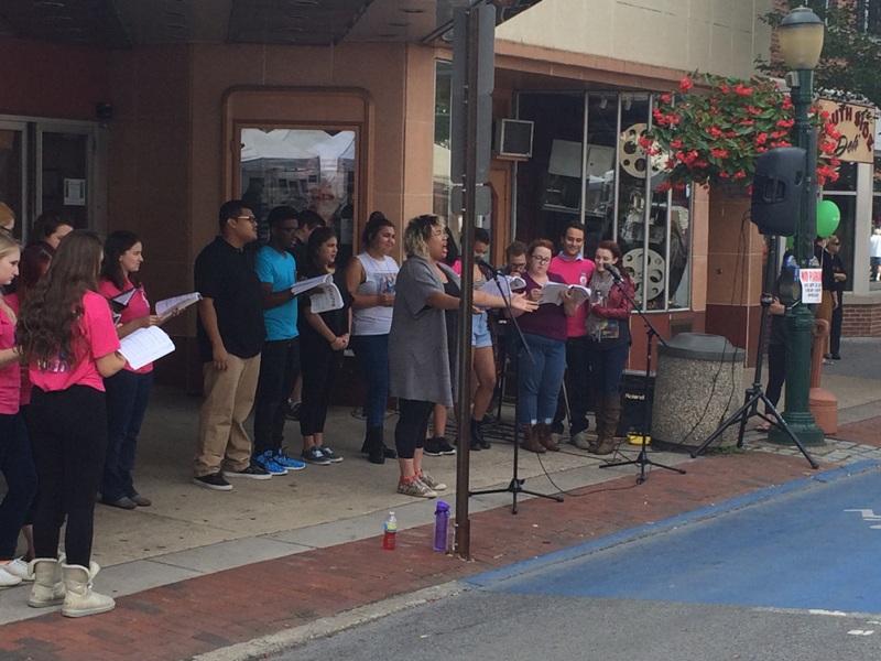 Members of the Carlisle Theater Companys cast of Hairspray perform downtown