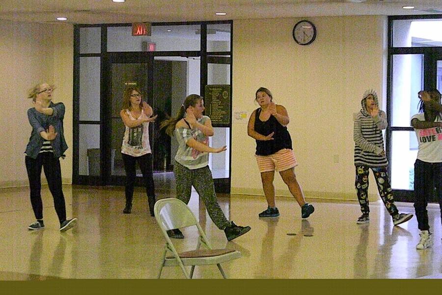 REACH! dancers practice their moves for their upcoming public performance. 