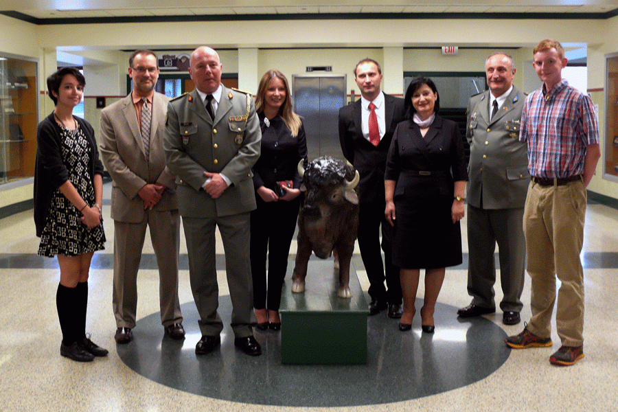 Rauscher, the Bazos and others pose for a picture with Thor.