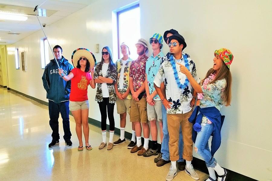 Students pose for the camera in their best Tacky Tourist outfits.