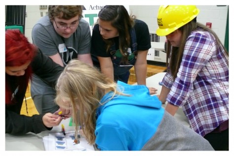 Freshman Olayah Safouan and her friends try to assemble Legos together 