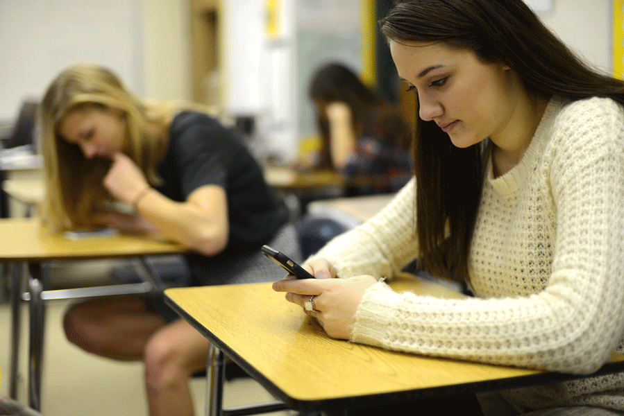 In todays times, its not hard to find students on their phones within classrooms.  In the hallways and cafeteria, however, they are still considered to be off-limits.