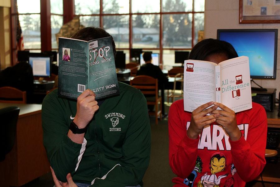 Two students reading Leah Ferguson and Kristy Shinns books