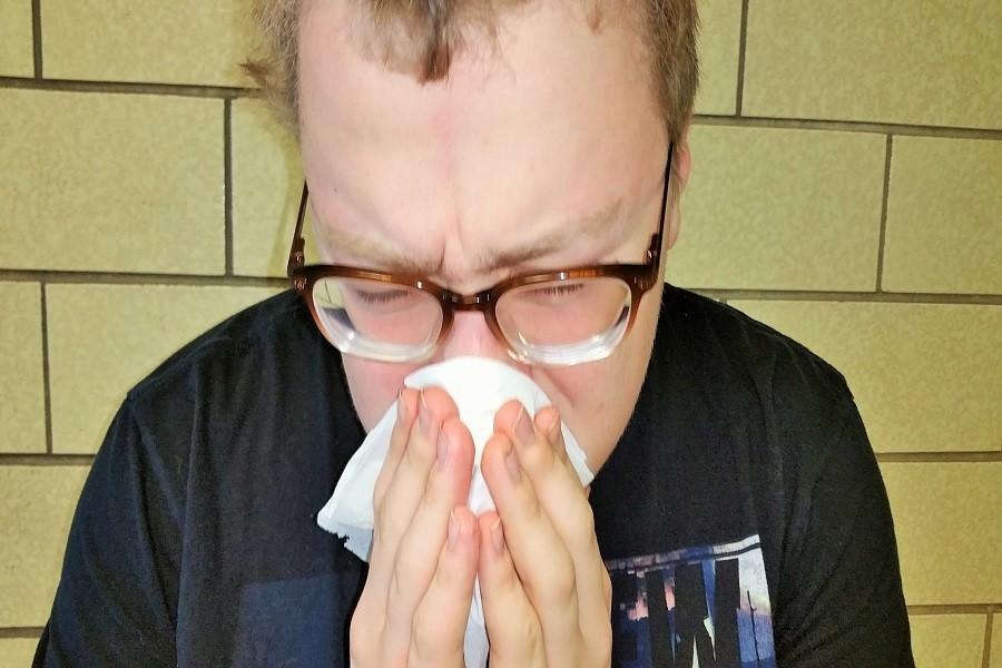 Evan Wallace combats the symptoms of seasonal allergies in the best way possible: with a tissue.