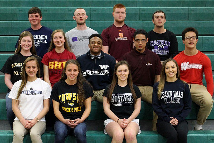 13 seniors made athletic commitments to their future schools on April 13.