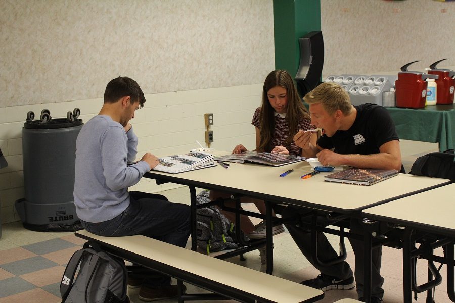 Students enjoy ice cream and a early look at their yearbooks during the distribution party.