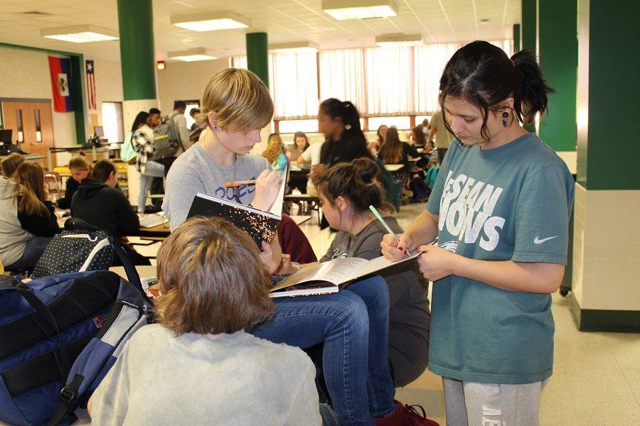 Juniors Gretchen Petresky and Kandie Lower signs each other's yearbooks. 
