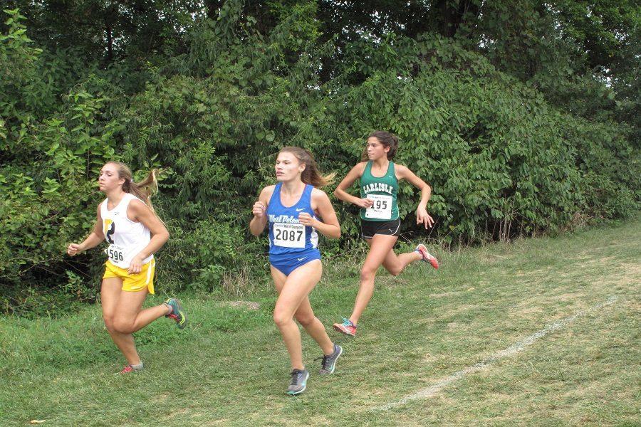 Carlisle sophomore Gracen Cabral runs in the varsity girls' race.