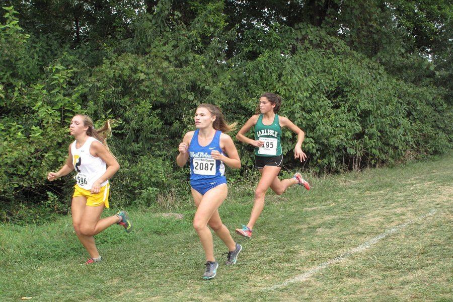 Carlisle sophomore Gracen Cabral runs in the varsity girls race.