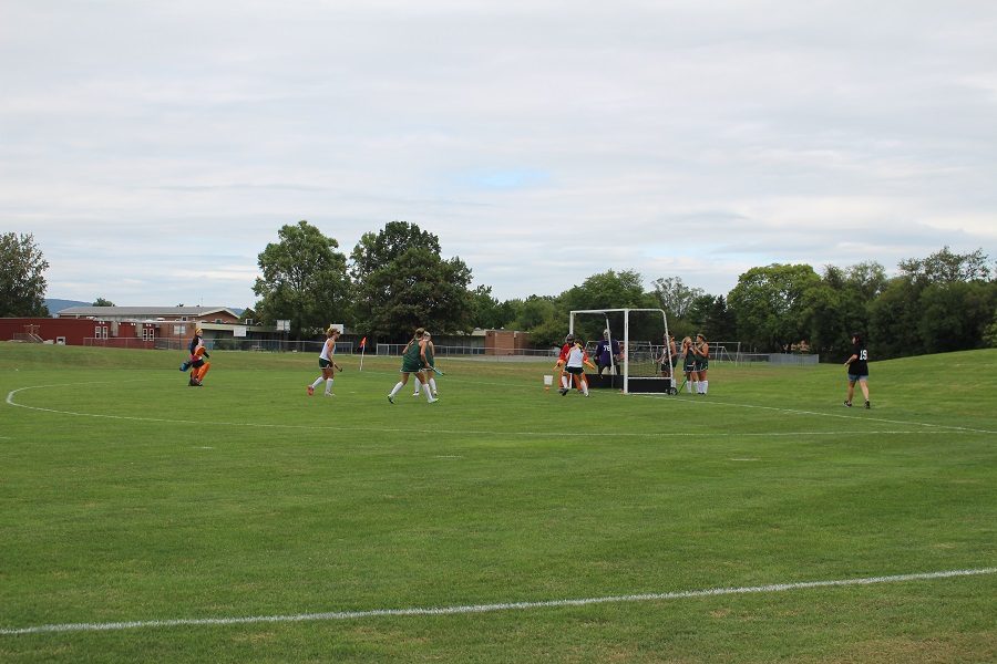 The varsity field hockey team warms up before their game against Cedar Cliff.