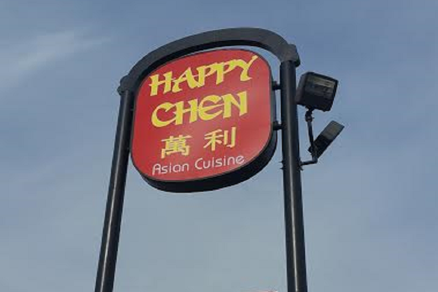 The Happy Chen restaurant welcomes guests with their sign high in the sky.