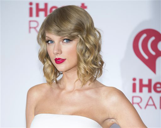  In this Sept. 19, 2014 file photo, Taylor Swift arrives at the iHeart Radio Music Festival in Las Vegas. Swift is releasing her fifth album on Monday, Oct. 27, 2014. 