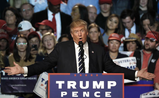 FILE - In this Tuesday, Nov. 8, 2016 file photo, Republican presidential candidate Donald Trump speaks at a campaign rally in Grand Rapids, Mich. In a new book, Megyn Kelly says Trump tried unsuccessfully to give her a free hotel stay as part of what she called his pattern of trying to influence news coverage of his presidential campaign. In Settle for More, to be released Tuesday, Nov. 15, 2016, Kelly also said Trump may have gotten a pre-debate tip about her first question, in which she confronted him with his critical comments about women. (AP Photo/Paul Sancya, File)