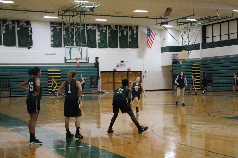 The girls basketball team practices in the McGowan gym.