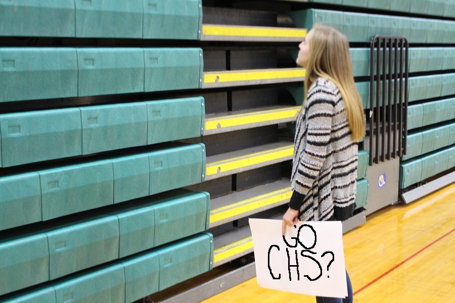 Student looks on at the closed stand wondering why there is no pep rally.  