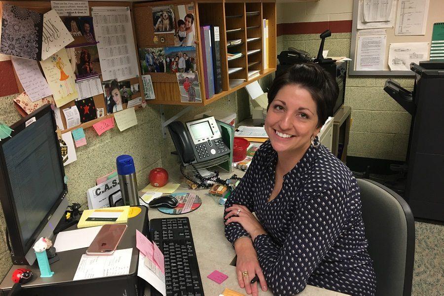 Priscilla Perdue poses at her desk in the Fowler Office. 