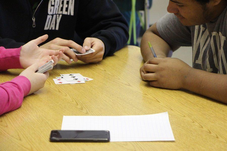 Kids having fun playing cards in Card Club.