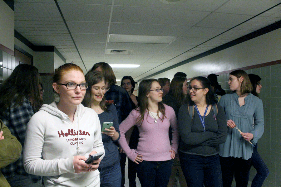 Students from the Page to Stage class wait anxiously as Biondo-Hench is about to be surprised with the dedication ceremony.