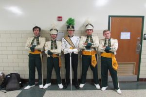 Junior Cameron Fritz, Junior Reese Bower, Senior Ben Adelberg, Senior Miguel Alvarez, and Junior Paul McIlhenny wear matching vintage band uniforms. Blast for the past was a very popular theme day with much participation.