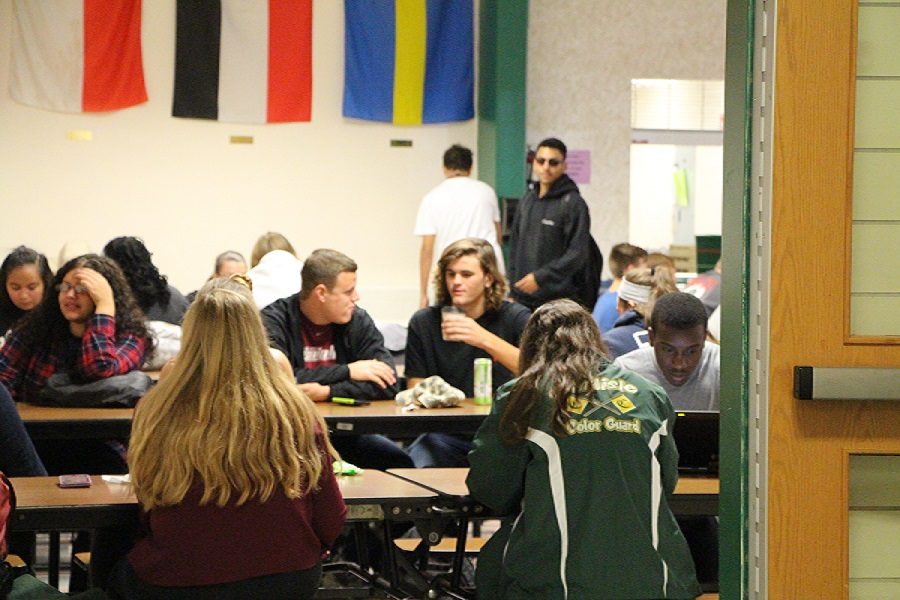 Students eat lunch in the cafeteria. Movies often depict cafeterias as a breeding ground for popularity problems but, is it?