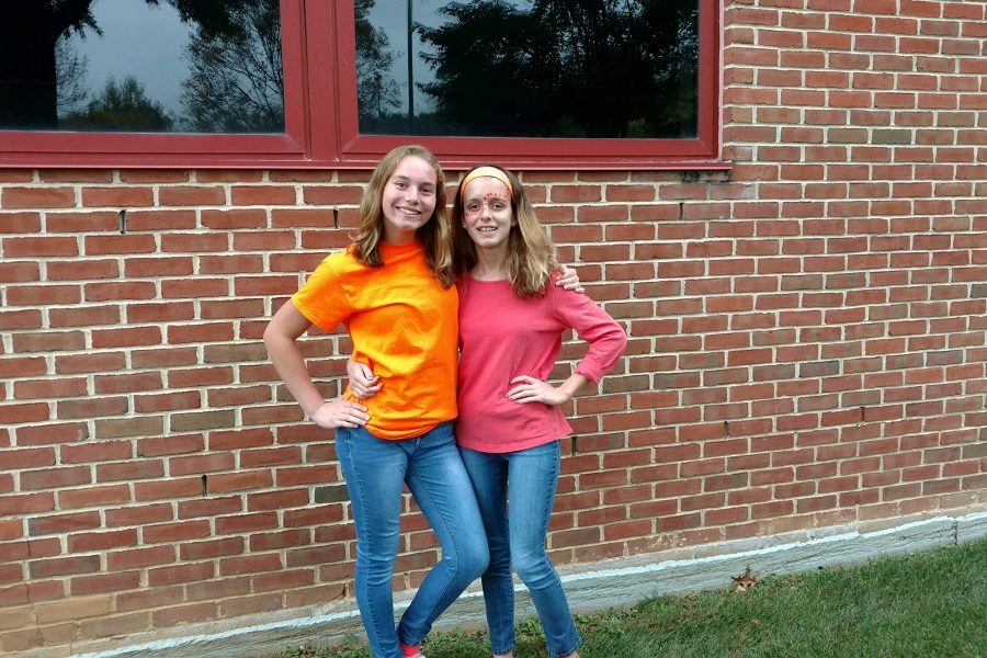 Sophomores Jesslyn Morrow and Madison Richwine pose in their orange. The sophomores placed second in the class wars.