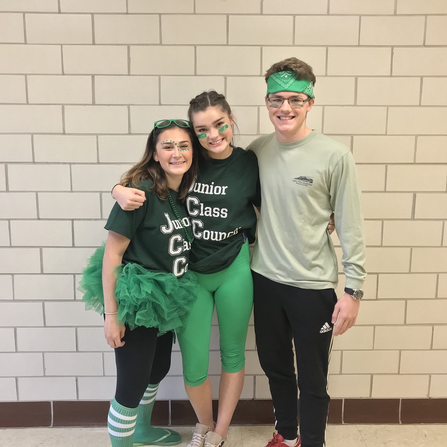 Juniors Caitlin Quattrone, Caroline Tyndall, and Nick Bowman pose together. Quattrone said, Spirit days create this kind of positive and fun energy throughout the school.
