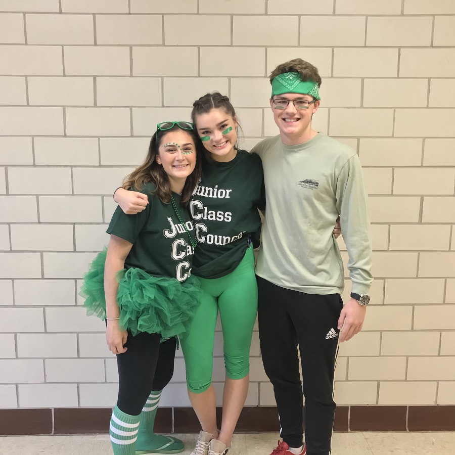 Juniors Caitlin Quattrone, Caroline Tyndall, and Nick Bowman pose together. Quattrone said, "Spirit days create this kind of positive and fun energy throughout the school."