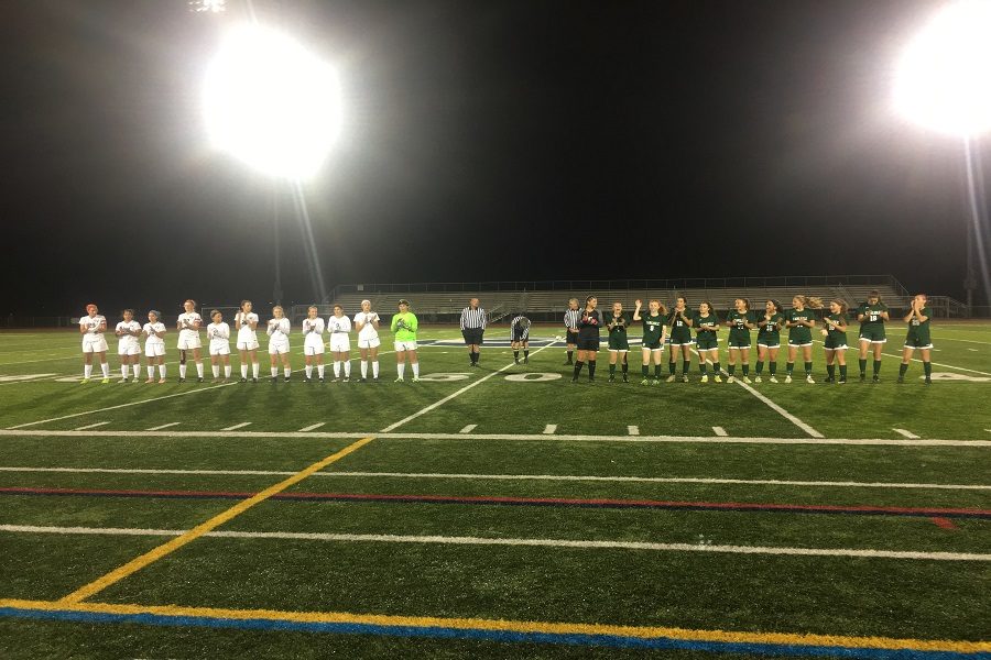 The+girls+soccer+starters+line+up+for+introductions+before+their+district+game.++This+was+their+first+time+being+in+this+position+for+five+seasons.