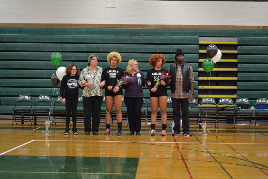 Yanna+and+Shay+Regis+at+senior+night+for+girls+volleyball.+Their+positive+influence+will+be+missed.