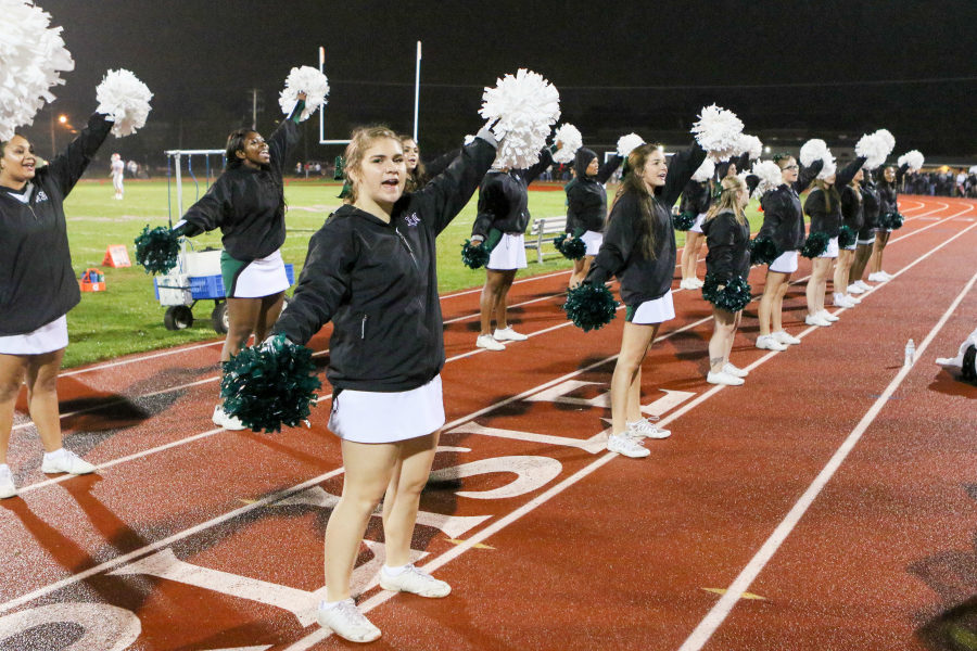 Katie Anderson cheers at home football game. The cheer program will be switching to their winter squad for basketball games, wrestling matches, and cheer competitions.