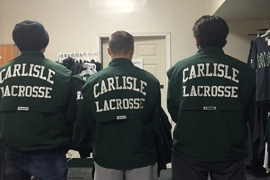 Lacrosse players show off their spirit wear jackets.  These are a really good way to represent school spirit. 