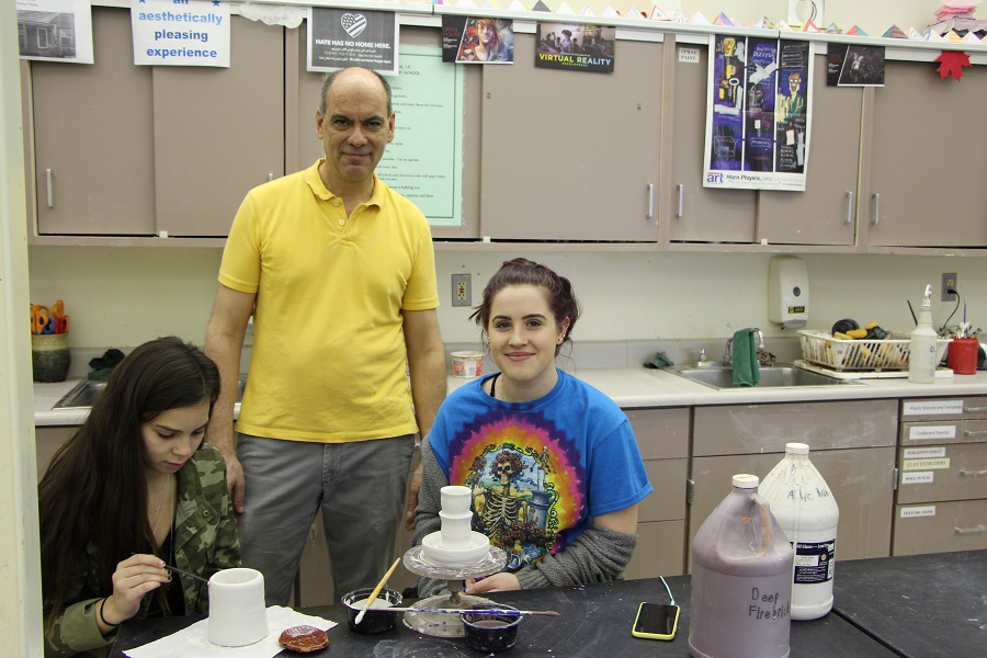 Francis Tolan works with April Haffly and Crystal Doporcyk on their Sculpture and Ceramics projects.
