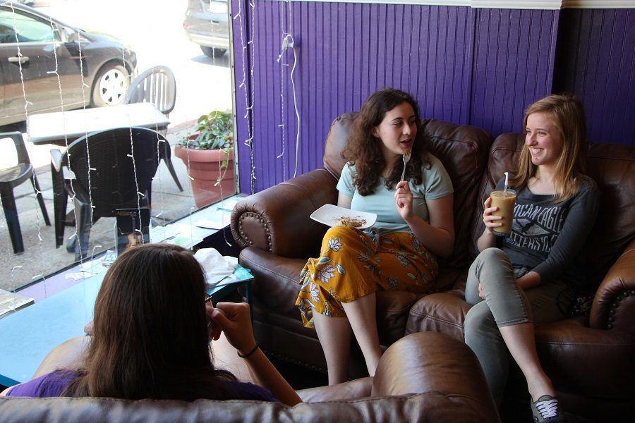 Students spend time catching up in a shop in downtown Carlisle. Downtown Carlisle has many unique places to explore over the summer.