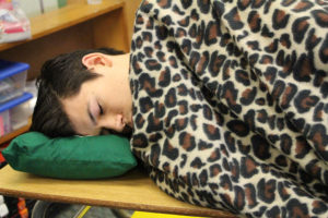 Senior Nick Brewbaker demonstrates his coping mechanism for senioritis: sleeping in class.