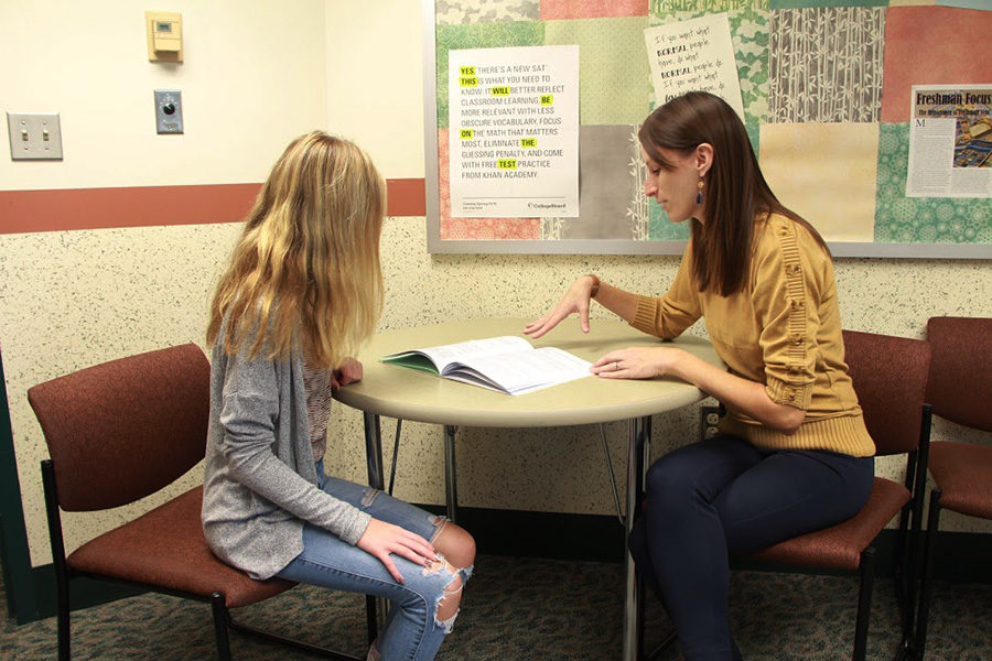 Mrs. Rotz goes over educational guide with a student. Electives open up possible careers to curious students.