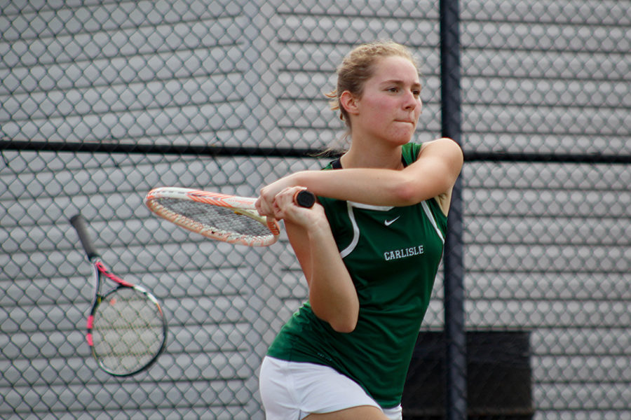 Jess+Morrow+swings+her+racket+during+a+tennis+match.+She+played+doubles+%232+for+the+varsity+tennis+team.+
