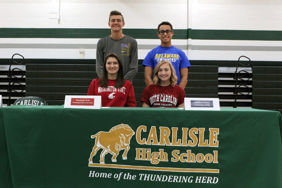 Seniors Liz Weis, Meg Lebo, Isaiah Bell, and Jack Wisner signed to play their respective sports at their future colleges on Nov 14.