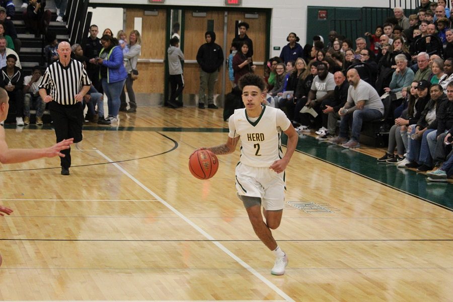 Howie Rankine dribbles the ball down the court against Big Spring on Dec 7.