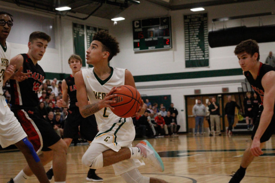 Eyes on the Prize: #2 Varsity Howie Rankine is ready to jump towards the net for Carlisle. 